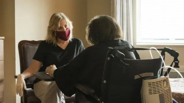 woman in care home with visitor