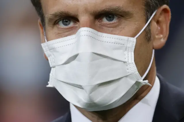 President of France Emmanuel Macron wearing a protective mask