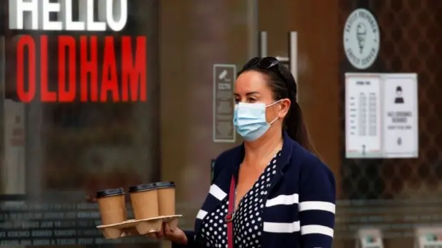 A woman wearing a face mask in Oldham