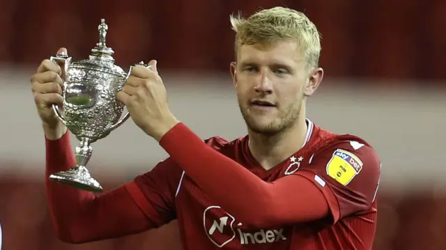 Joe Worrall with the Brian Clough Trophy