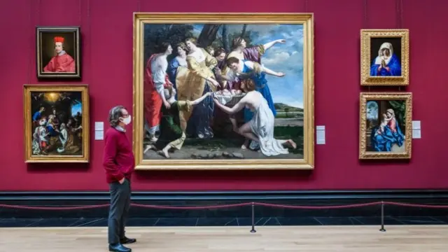 A man views  "The Finding of Moses" by Orazio Gentileschi, part of an exhibition at London's National Gallery