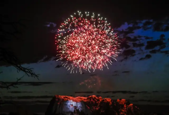 Fireworks flare up in the sky over Mt. Rushmore National Monument in Keystone, South Dakota, USA, 03 July 2020