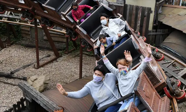 People enjoy a ride at the Chessington World of Adventures in Chessington, Britain, 04 July 2020. Pubs, restaurants, places of worship, hairdressers and other businesses are reopening their doors across the UK today on "Super Saturday" after more than three months of lockdown