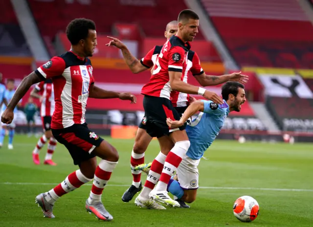 Bernardo Silva goes down under a tackle