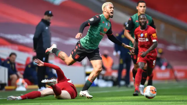 Andrew Robertson fouls Douglas Luiz