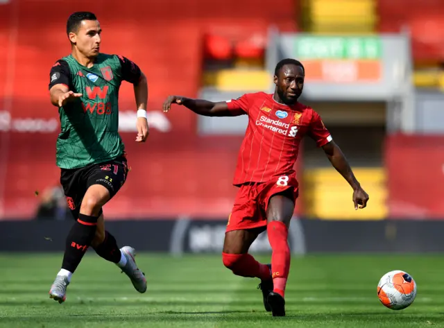 Naby Keita of Liverpool is challenged by Anwar El Ghazi of Aston Villa