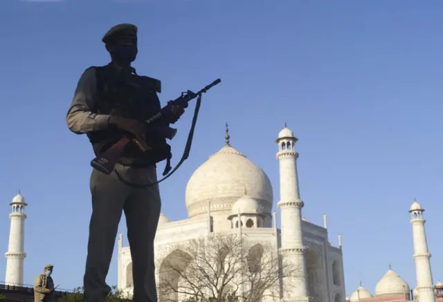 A soldier stands guard near the historic monument Taj Mahal during the nationwide lockdown continues over the highly contagious coronavirus