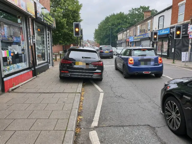 Car parked near pedestrian crossing