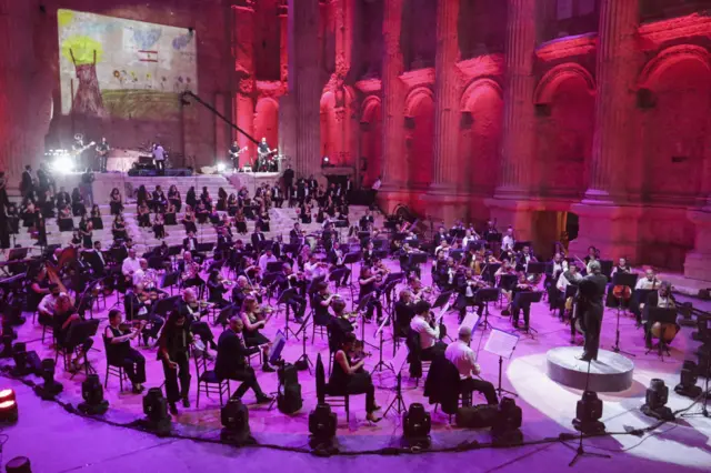 Maestro Harout Fazlian conducts rehearsals ahead of the Sound of Resilience concert inside the Temple of Bacchus