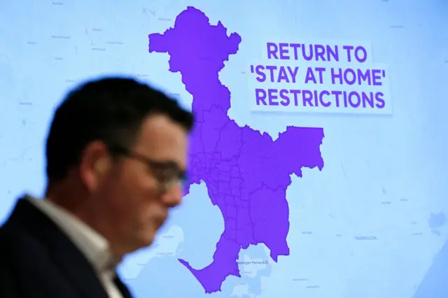 A graphic is seen showing the areas of Victoria that will be required to go into lockdown as Victorian Premier Daniel Andrews speaks