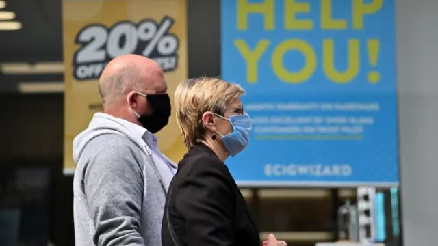 The UK lags behind in setting clear policies on face coverings and on using them, the Royal Society says
