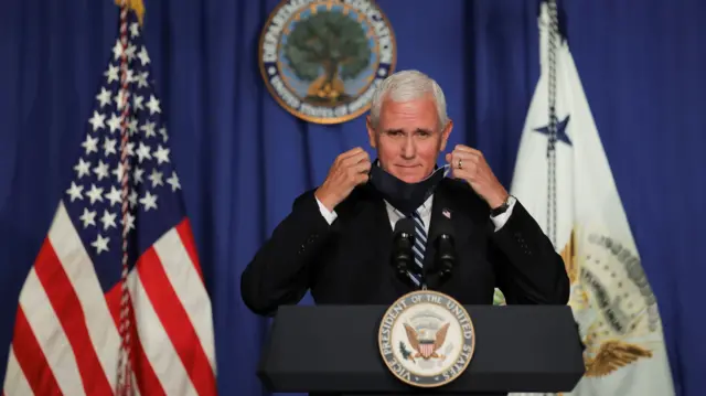 Mike Pence removing mask to speak to reporters