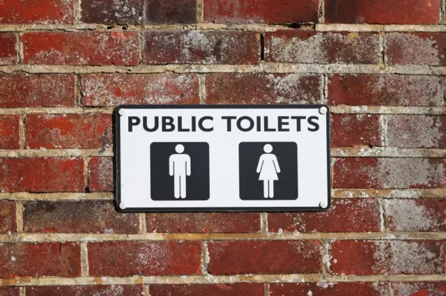 Public toilets sign