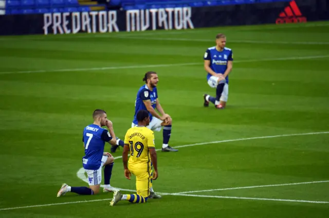 Birmingham and Swansea players take a knee