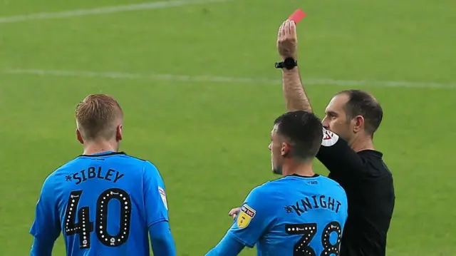 Derby's Louie Sibley is sent off by Jeremy Simpson