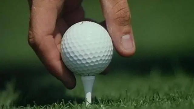 Golf ball on tee peg