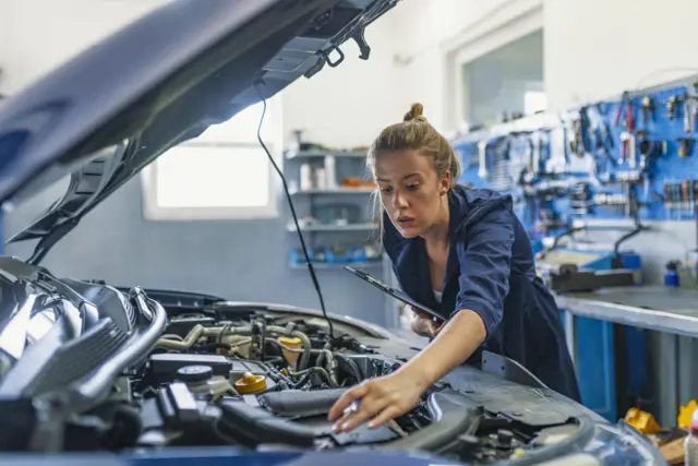 Mechanic working on car