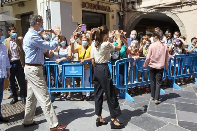 King Felipe VI of Spain and Queen Letizia of Spain wave to well wishers in Jaca