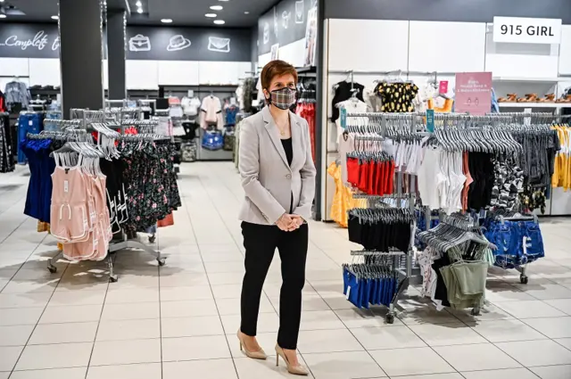 Nicola Sturgeon in shop wearing mask