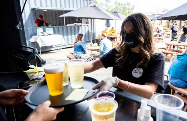 Waitress in a mask at Glasgow Beer Works