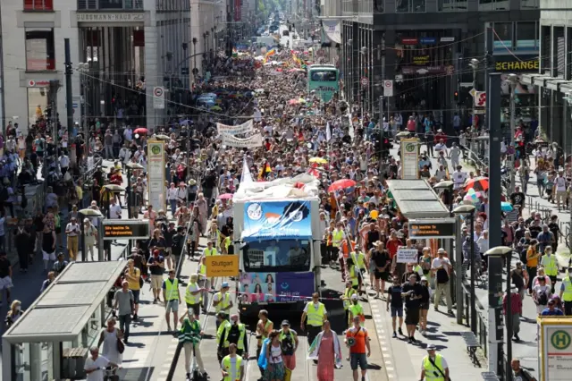 Demonstrators march during a protest against the government's restrictions amid the coronavirus disease