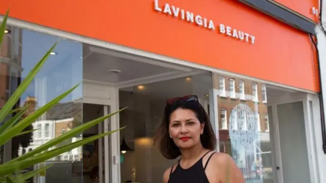 Gita Lavingia standing outside her shop