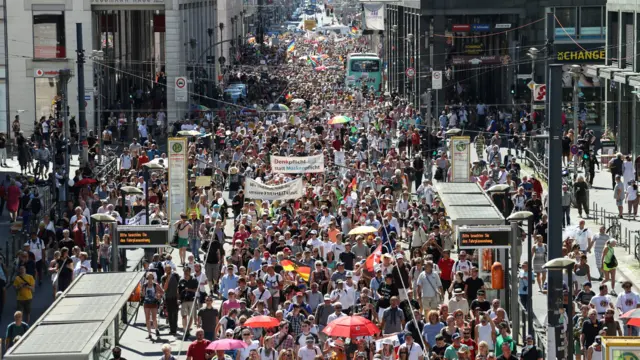 Demonstrators march during a protest against the government"s restrictions amid the coronavirus outbreak, in Berlin, Germany, 1 August , 2020