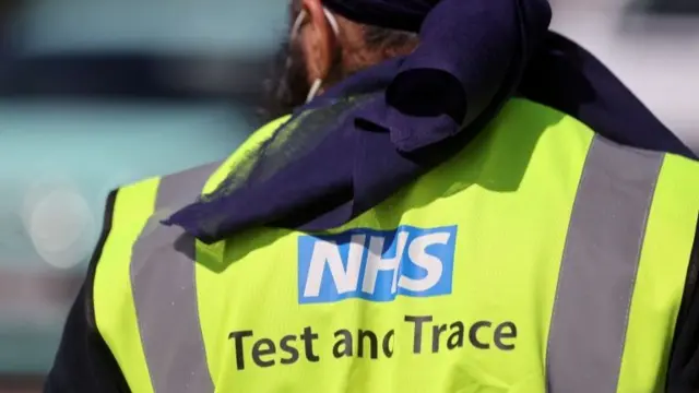 An NHS Test and Trace employee