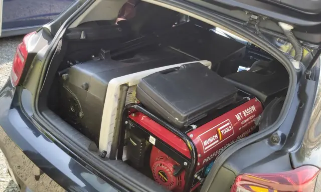 Generator and dance event equipment in the boot of a car