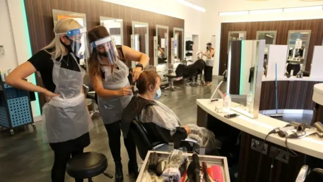 Someone getting their haircut at a hairdressers