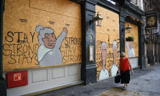 A boarded up pub in London