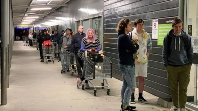 Shoppers outside a supermarket in Auckland