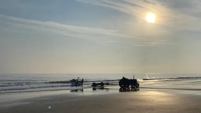 Tractor pulling boat at Cromer