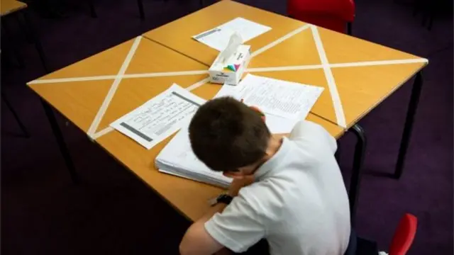 boy in social distance classroom