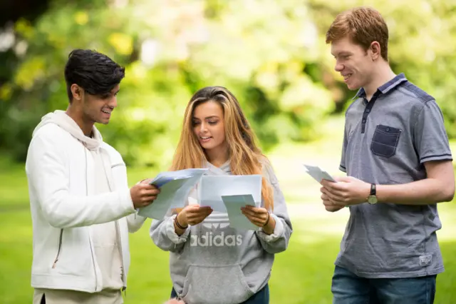 Abu Latif, Joe Cunningham and Vicky Baker look at their AS Level results at Ffynone House School, in Swansea/