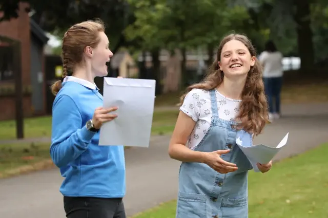 Sophie Lofthouse (left) and Hannah Walton-Hughes react as students at The Mount School, York