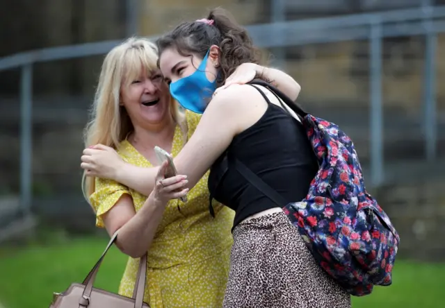 A sixth form student reacts after receiving her A-Level results at The Crossley Heath Grammar School