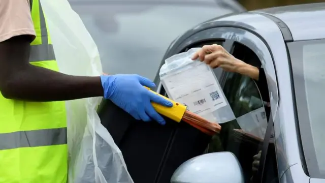 Woman hands over test