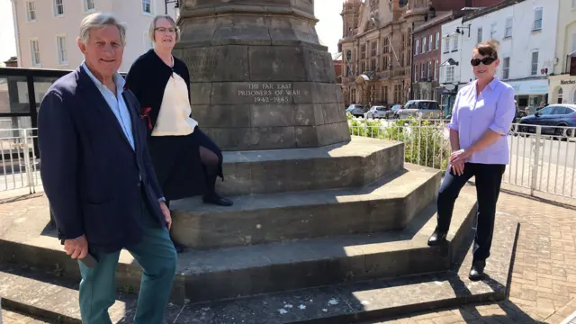 Campaigners by the war memorial