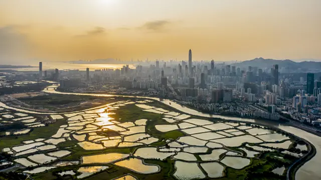 Aerial view of the Shenzhen River, or Sham Chun river, marking the border between residential and commercial buildings in Shenzhen, right, and farmland in Hong Kong, left, on March 10, 2020 in Shenzhen, Guangdong Province of China