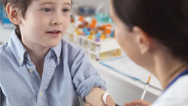 Boy being given a vaccine