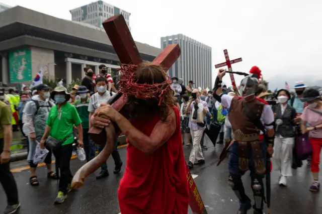 Demonstrators dressed as Jesus march the Presidential palace(Cheong Wa Dae) during a rally against the government on August 15, 2020 in Seoul, South Korea