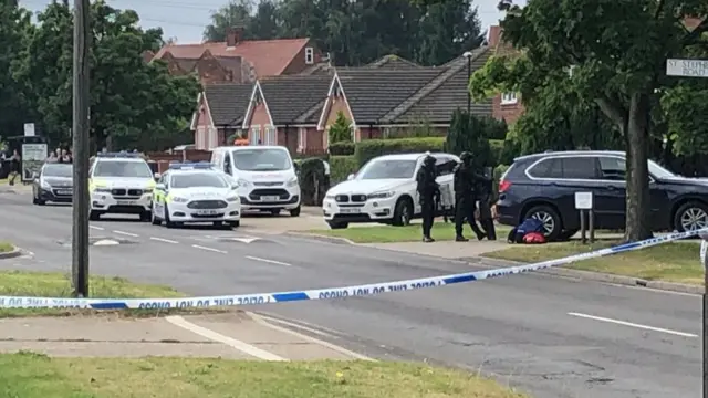 Officers outside the house