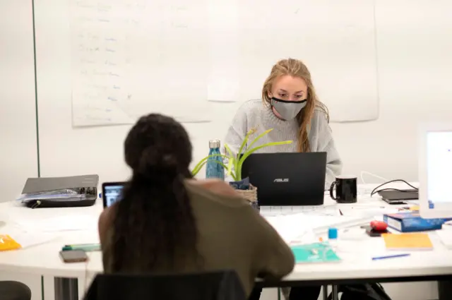 An employee wearing a face mask in Champs Sur Marne, France (May 2020)