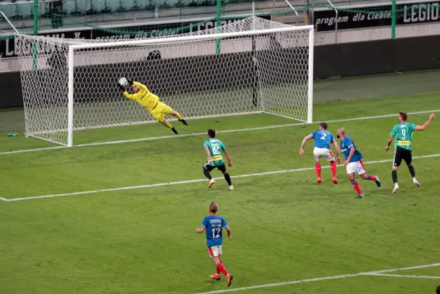 Linfield keeper Chris Johns at full stretch to deny Legia Warsaw