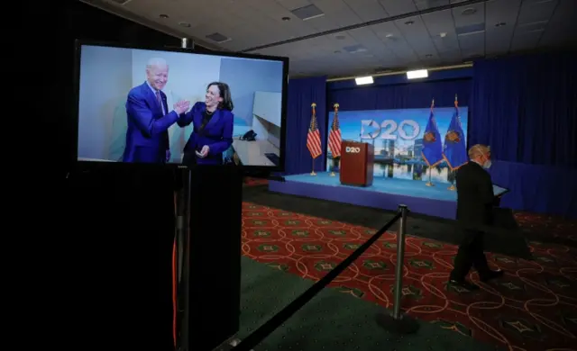 TV screen with Kamala Harris and Joe Biden