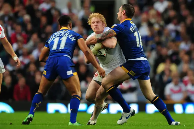 James Graham tussles with Leeds' Jamie Peacock and Jamie Jones-Buchanan