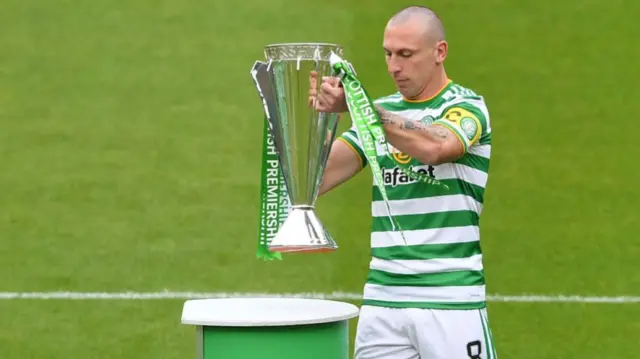 Celtic captain Scott Brown with the Premiership trophy