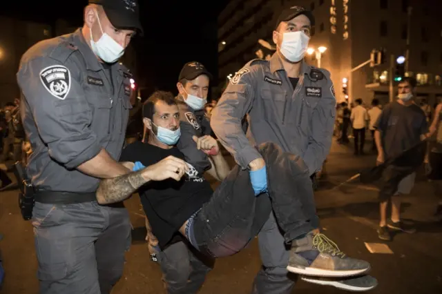 Israeli police arrest people during a protest against Israeli prime minister Benjamin Netanyahu