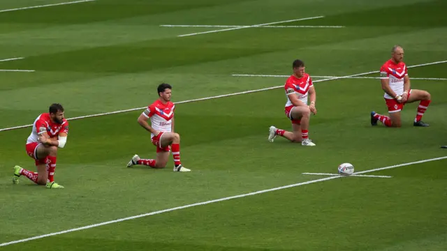 St Helens players take a knee